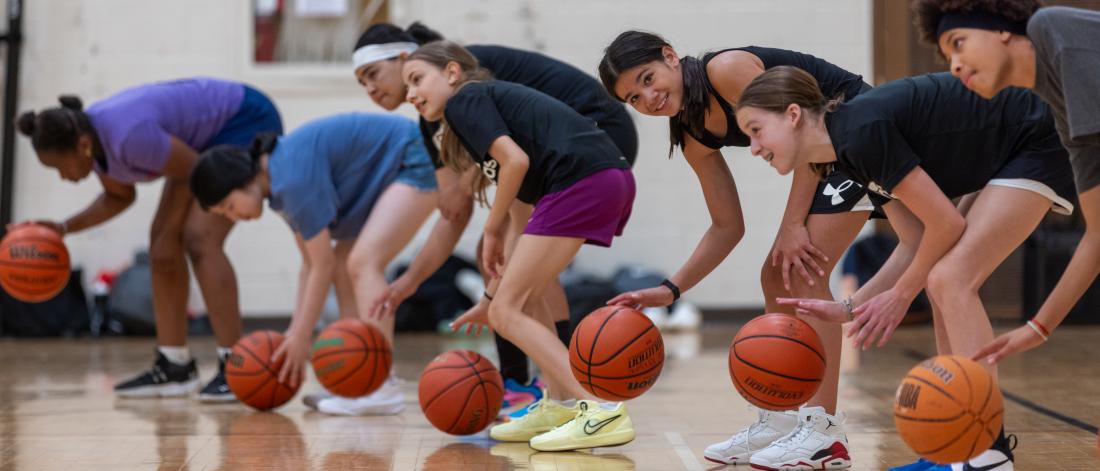 participants bouncing basketballs
