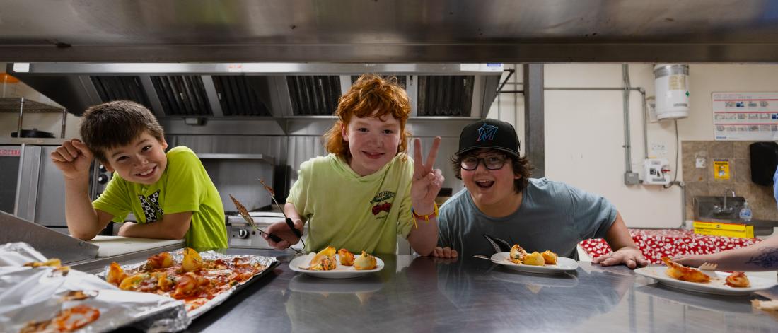 participants posing while in a kitchen