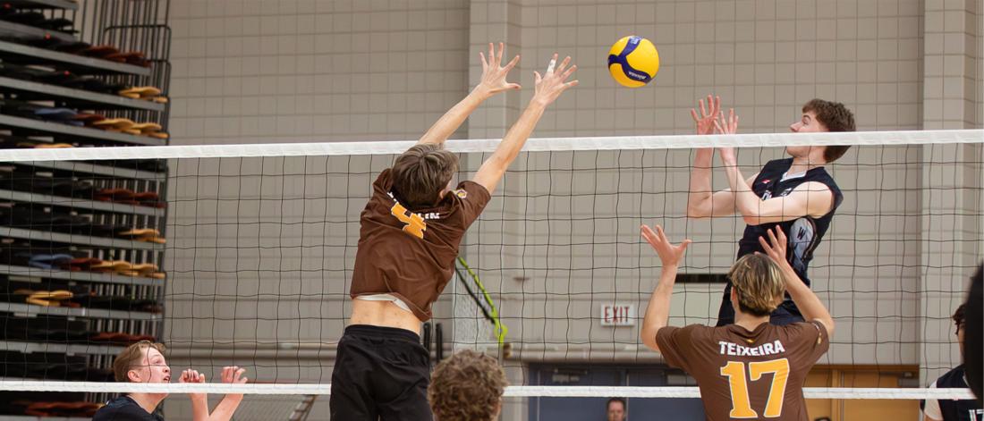 A Junior Bisons volleyball player blocks the ball during Central Showdown 2026.