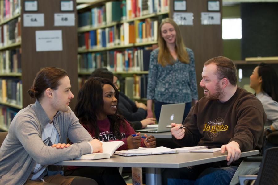 Students having a discussion in a library