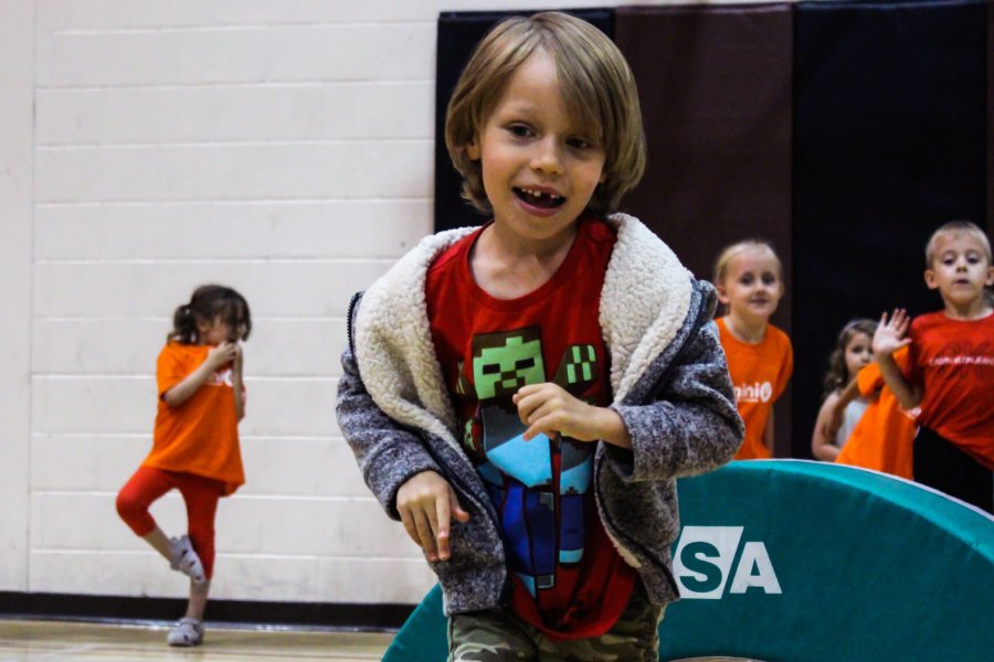 Mini U kids cheering each other on as they play.