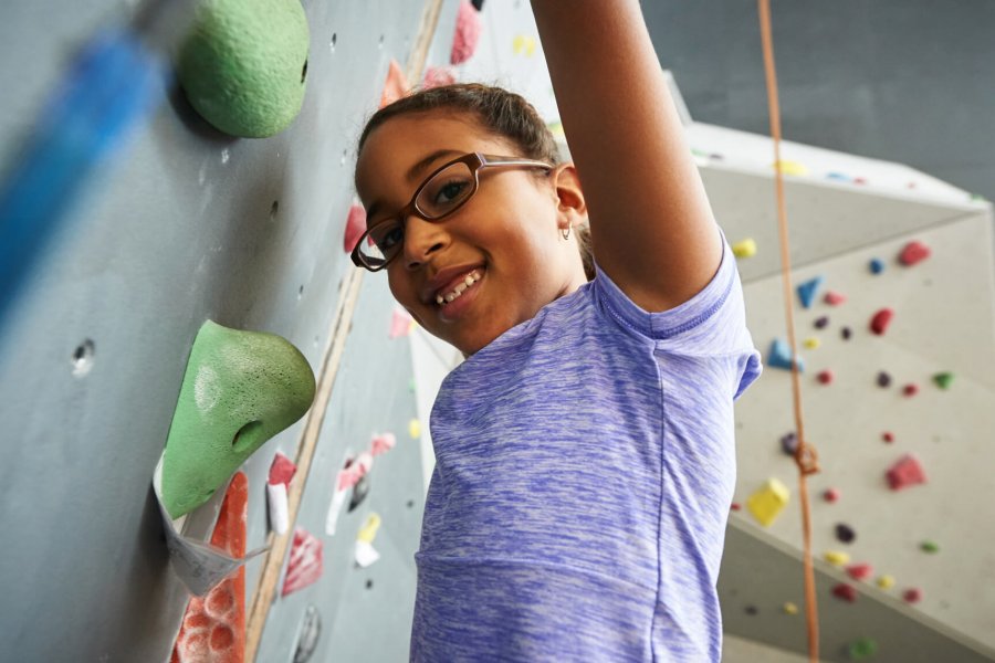 A Mini U participant climbs for the first time.