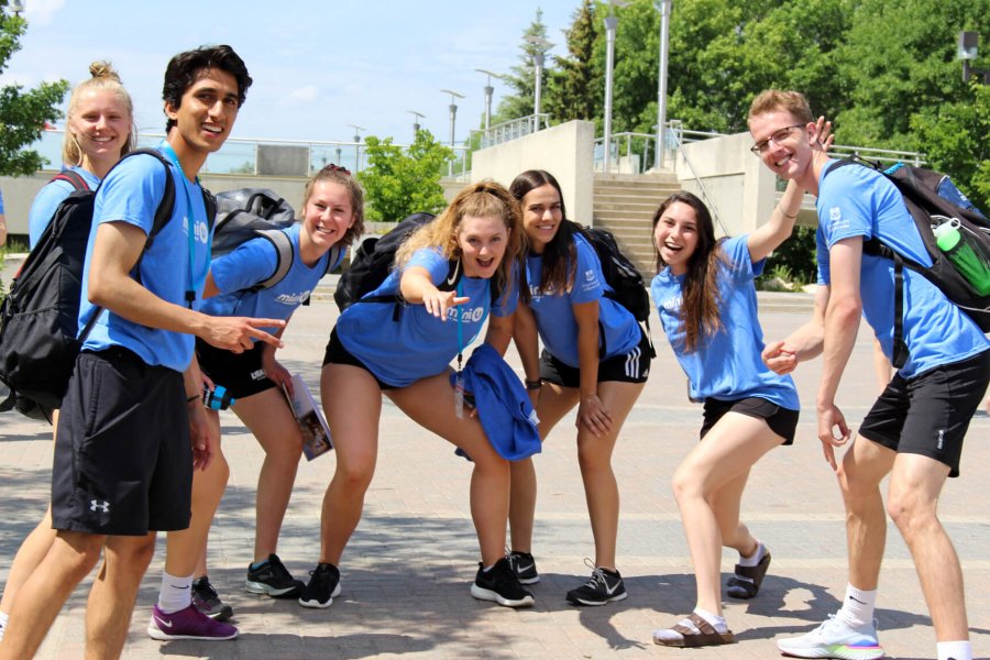 A group of seven Mini U leaders pose together for an energetic photo.