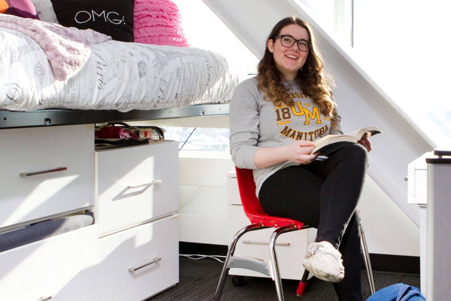 A University of Manitoba student studying in her Pembina Hall dorm room.