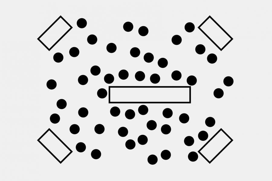 A small rectangular table in each corner of a room with a large table in the centre and scattered seating throughout.