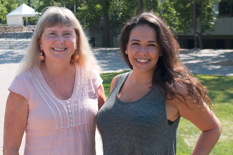 Two women standing side by side.