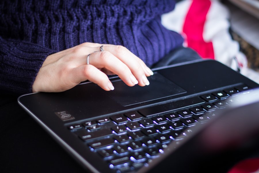 hand typing on laptop