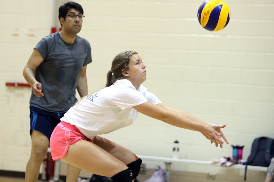 student playing volleyball