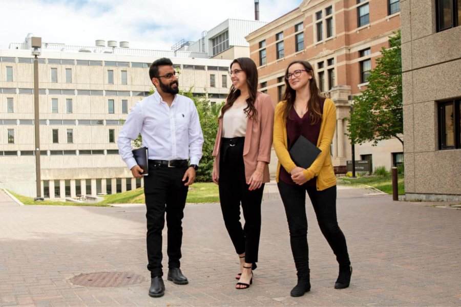 Students walking outdoors together at the University of Manitoba Fort Garry campus. 