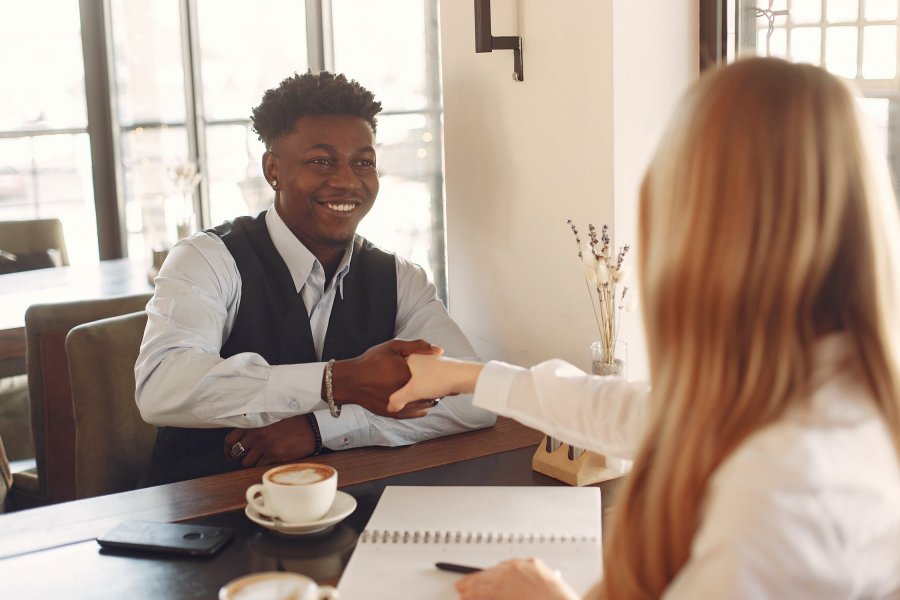 Job interviewer shaking applicants hand