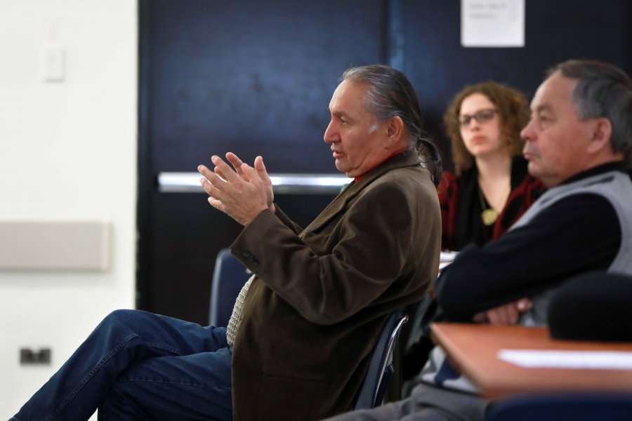 Carl Stone speaking at a Town Hall meeting.