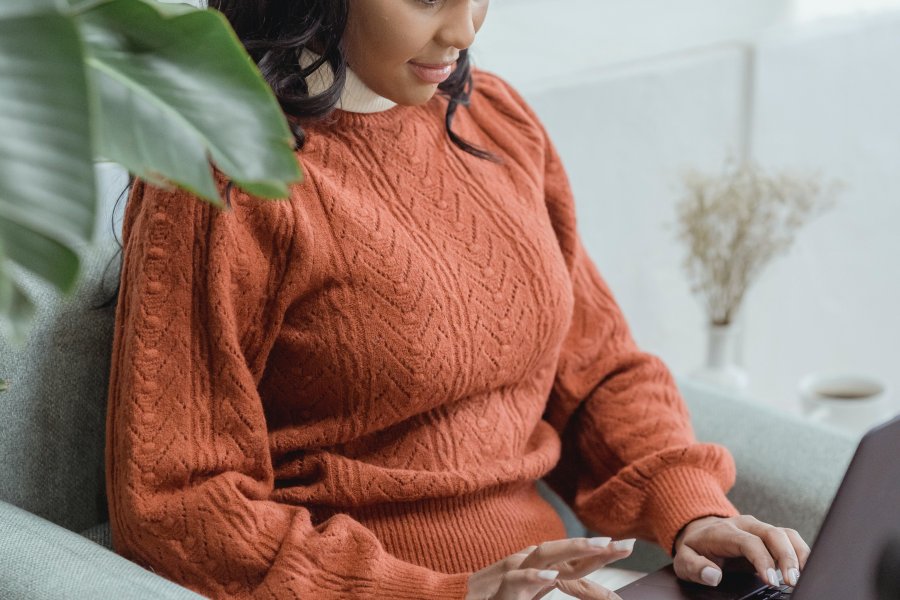 Young alumna on her laptop