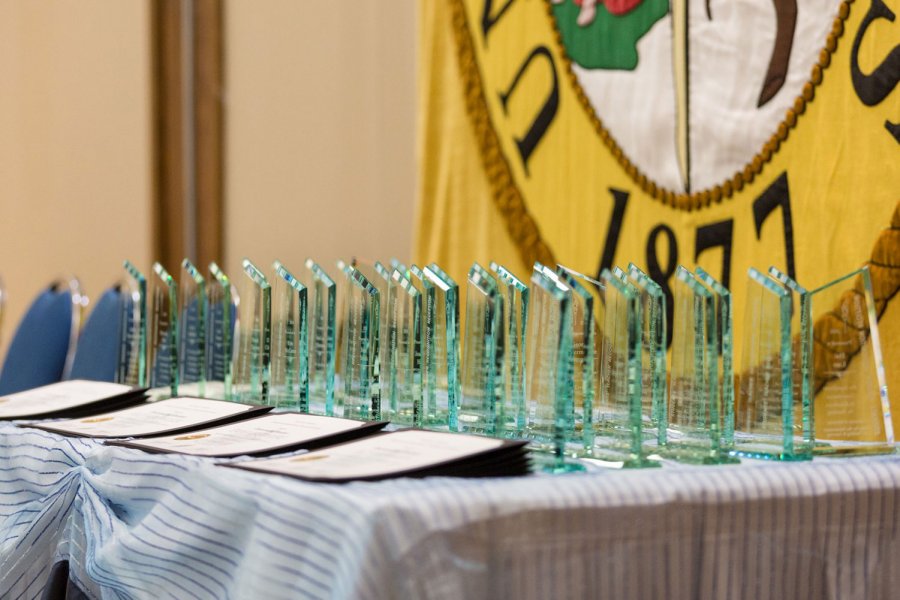 Engraved STRR awards lined up on a table