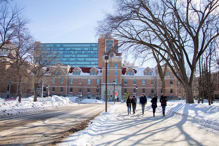 Students walking on Fort Garry campus in winter.