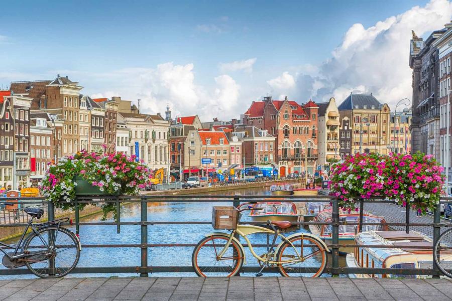 image of bicycle on a bridge over a canal in Amsterdam