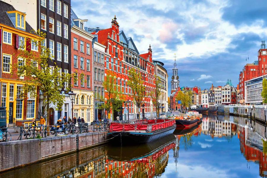 buildings to the right of a canal in Amsterdam