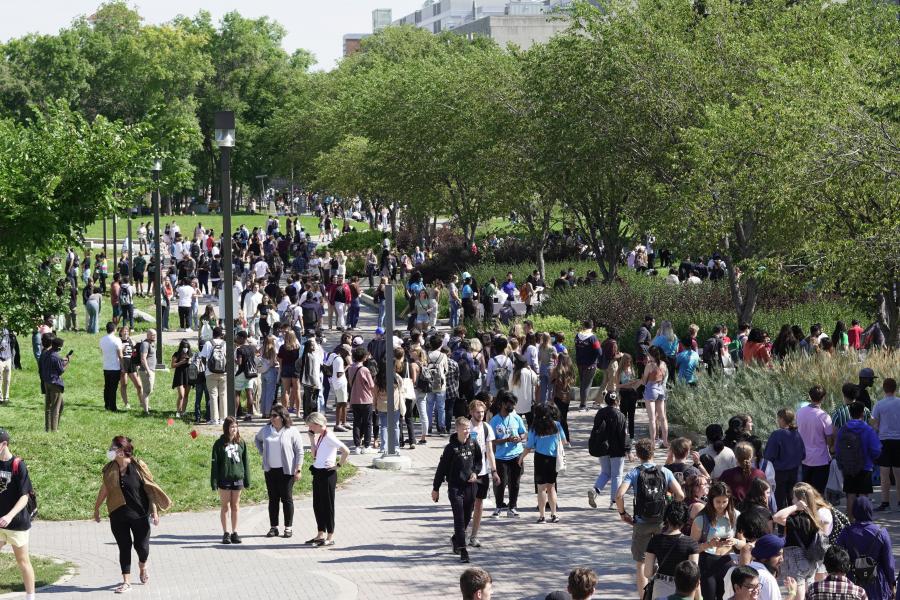 Students walking on a sidewalk