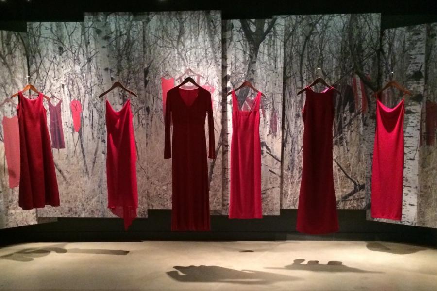 Red dresses hanging as part of the Red Dress Project at the CMHR 