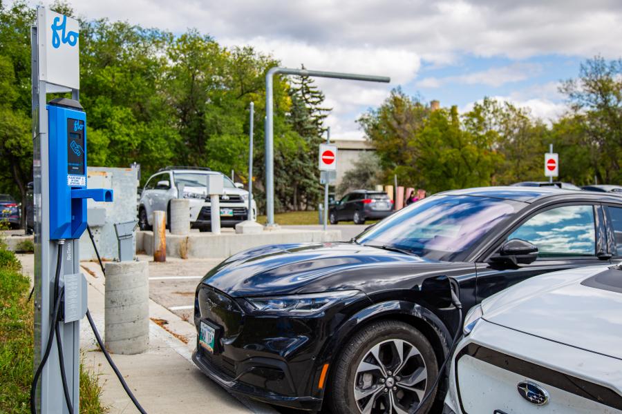 Vehicles charging at EV charger