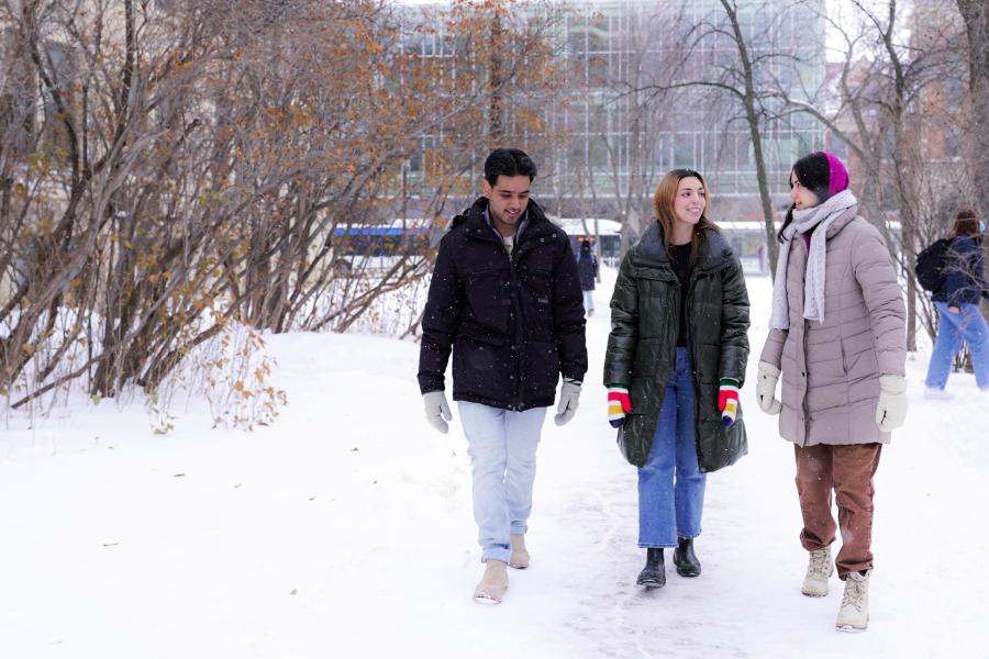 Students walking outside and chatting in winter