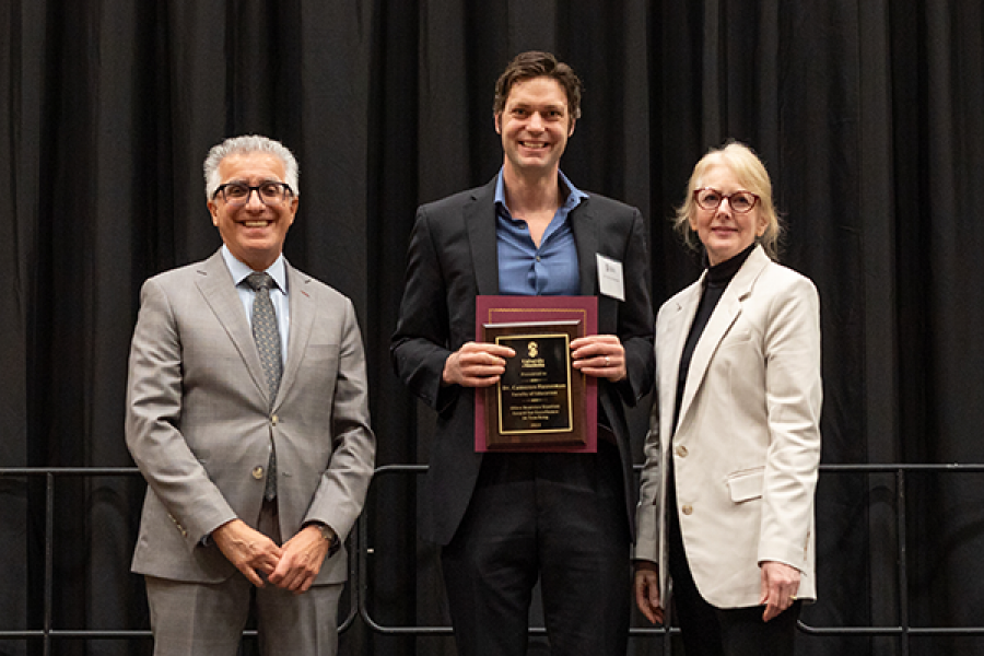 photo of faculty member receiving an award