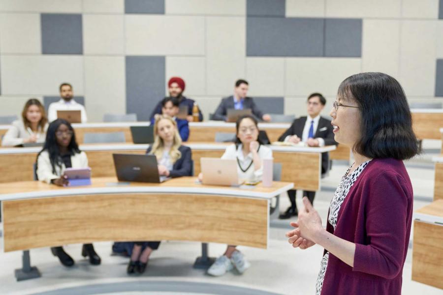 An instructor speaks to a class.