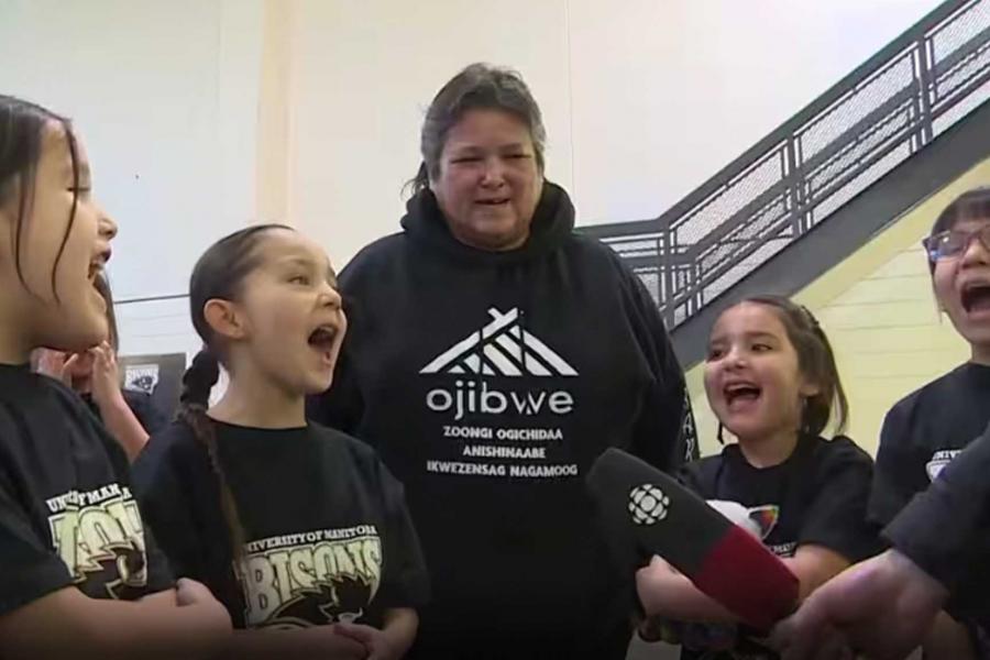 The Strong Warrior Girls Anishinaabe Singers performing the national anthem in Anishinaabemowin. 