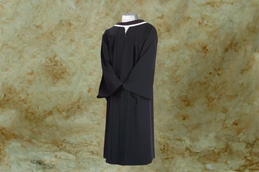 A mannequin wearing a standard black graduation gown.