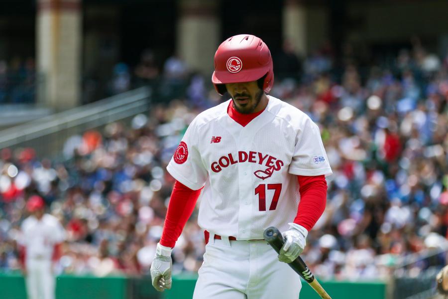 Goldeyes Player Number 17 carrying a bat, walking