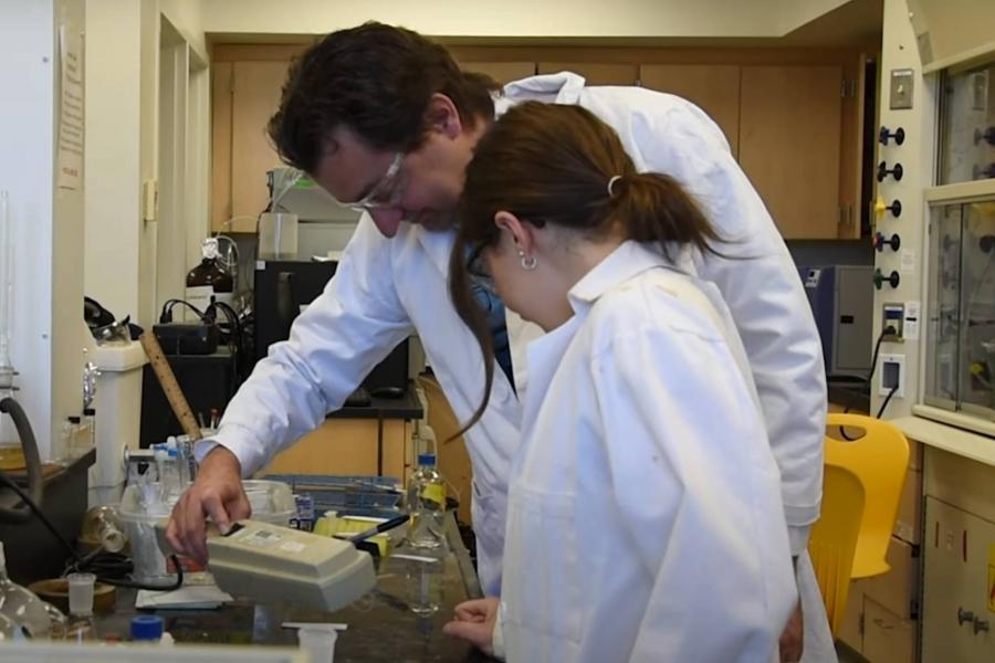 John Sorensen and Randi Roy in a lab.