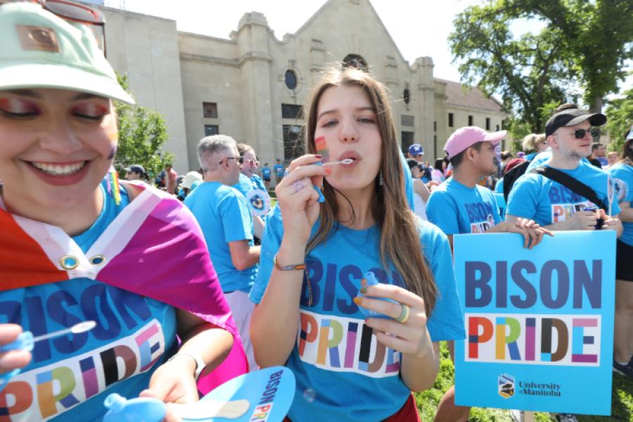 girl blowing bubbles at pride parade