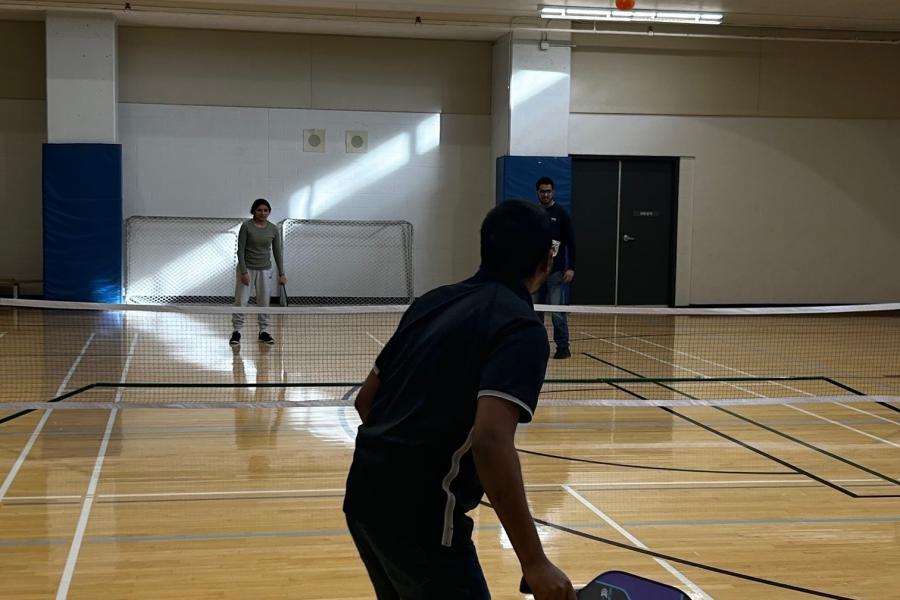 members playing pickleball