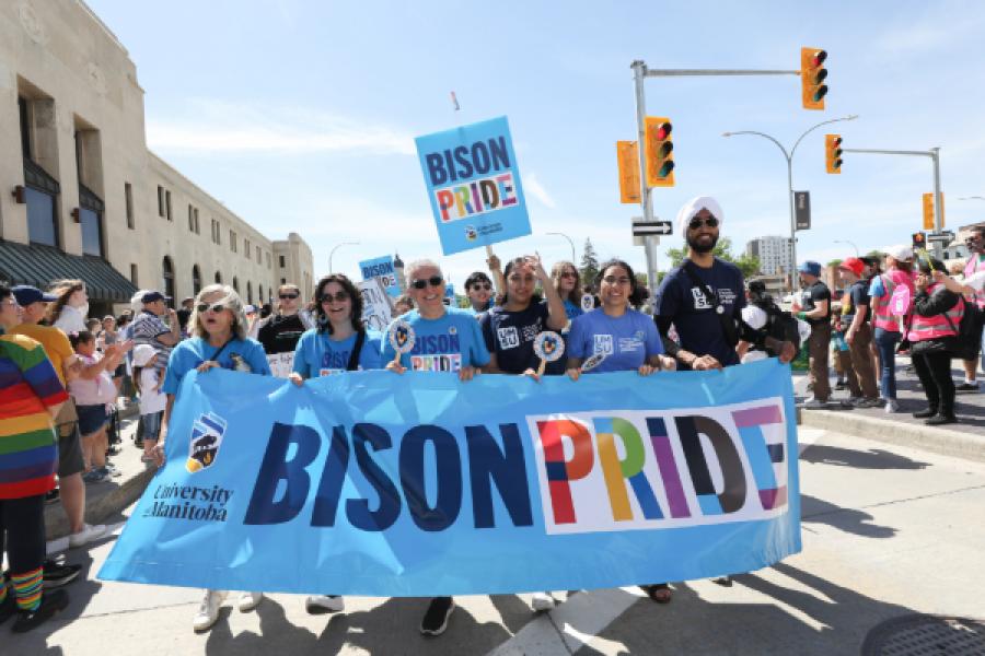 UM representatives holding the Bison Pride banner at Winnipeg Pride Parade