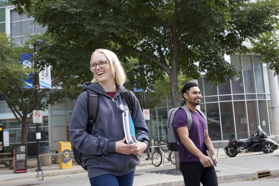 Students walking outside of Bannatyne campus at the University of Manitoba.