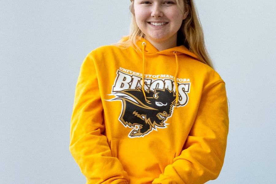 Young lady in yellow UM Bisons hoodie