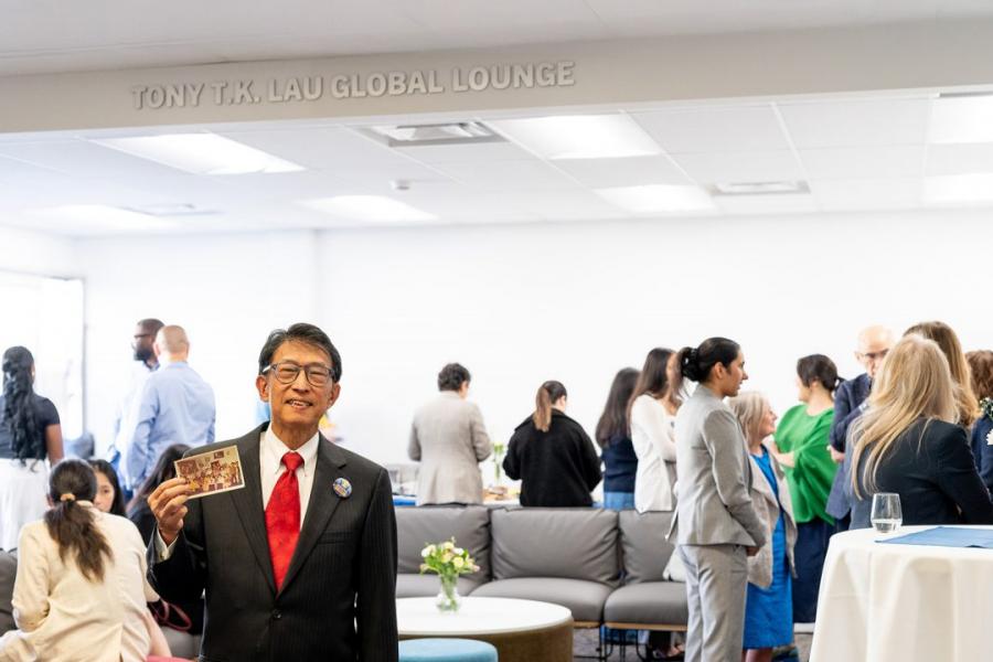 Tony T.K. Lau standing in the Global Lounge