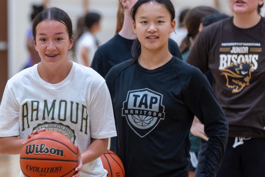 Athletes holding a basketball