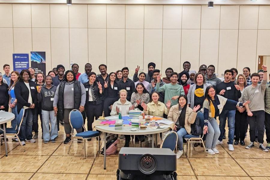 group of students and faculty cheering at better together