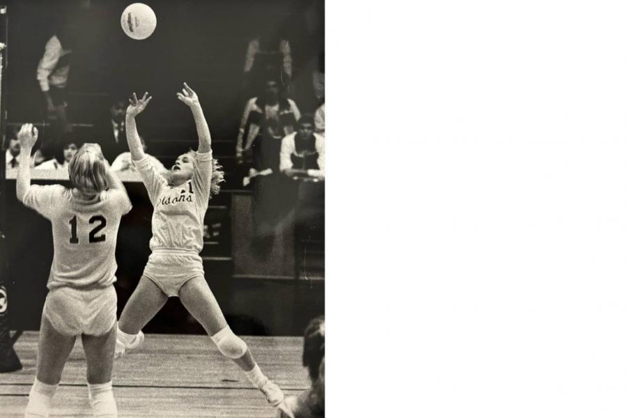 A bisons volleyball player lines up to volley a ball.