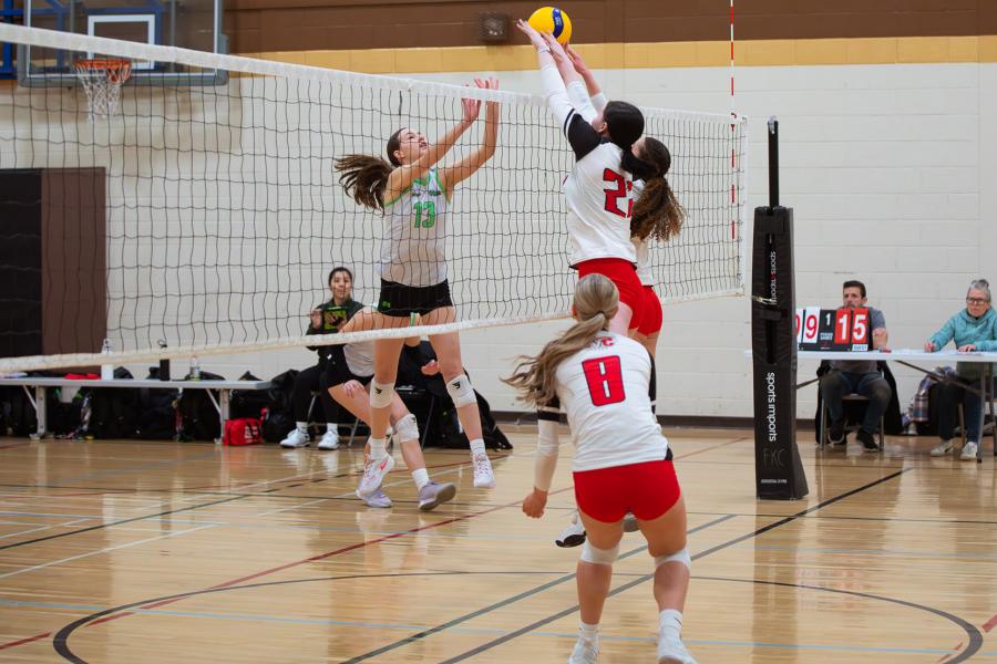 Action shot at the net at Central Showdown volleyball tournament in March 2026.
