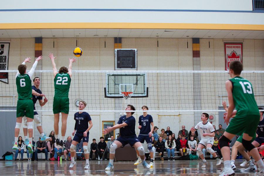 Players block the ball at Central Showdown volleyball tournament in March 2026.