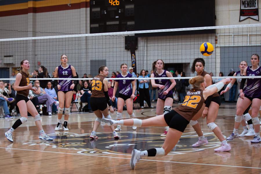 A player dives for the ball at Central Showdown volleyball tournament in March 2026.