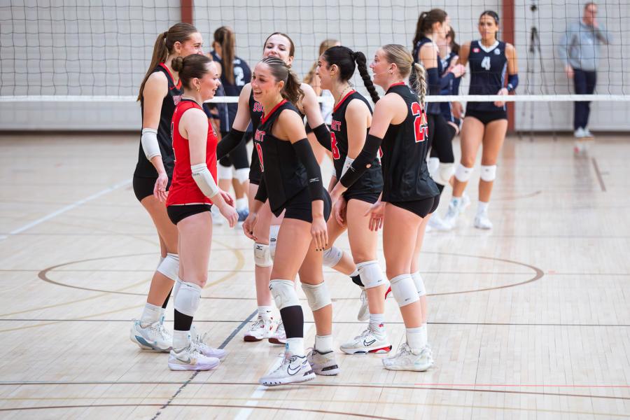 A group of players give each other encouragement during a game at Central Showdown volleyball tournament in March 2026.