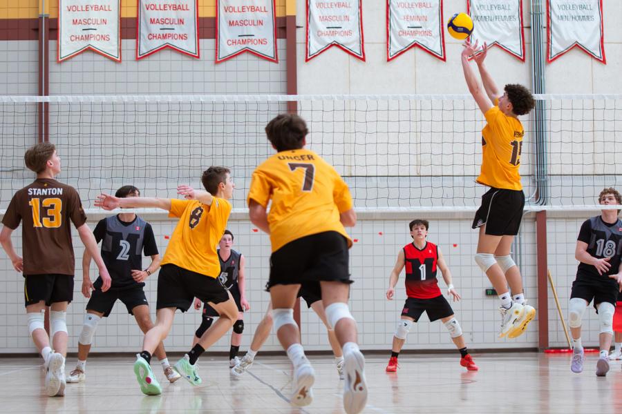 A Junior Bisons sets the ball for an attack.