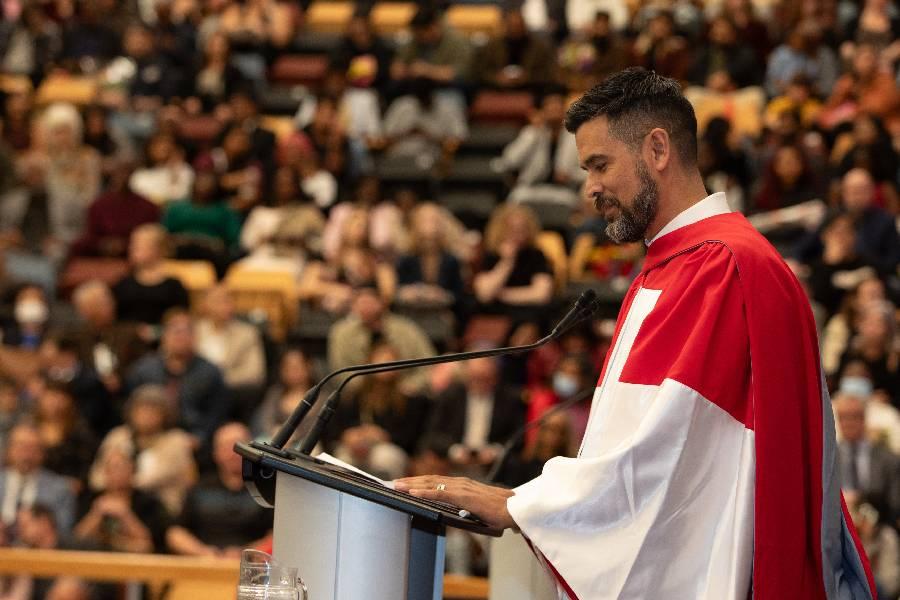 Honorary Degree recipient David A Roberston at a podium at convocation. 