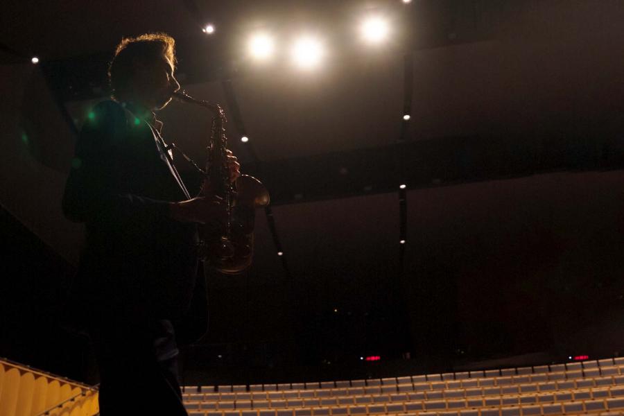 a man playing the saxophone at the Desautels Concert Hall