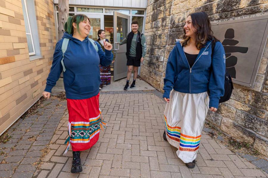 Indigenous students walking out of Migizii Agamik
