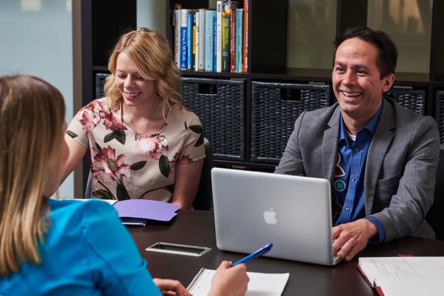 three University of Manitoba employees working together