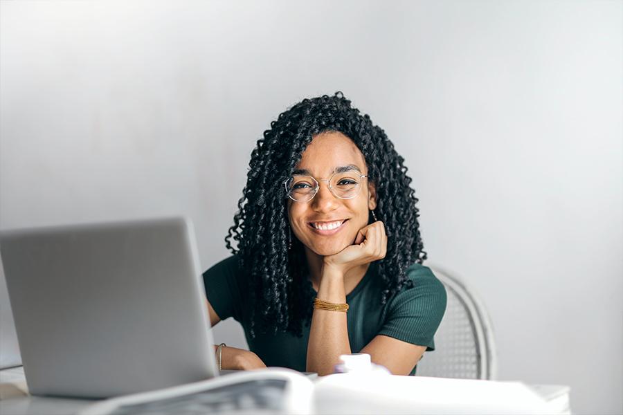 Woman at desk with laptop