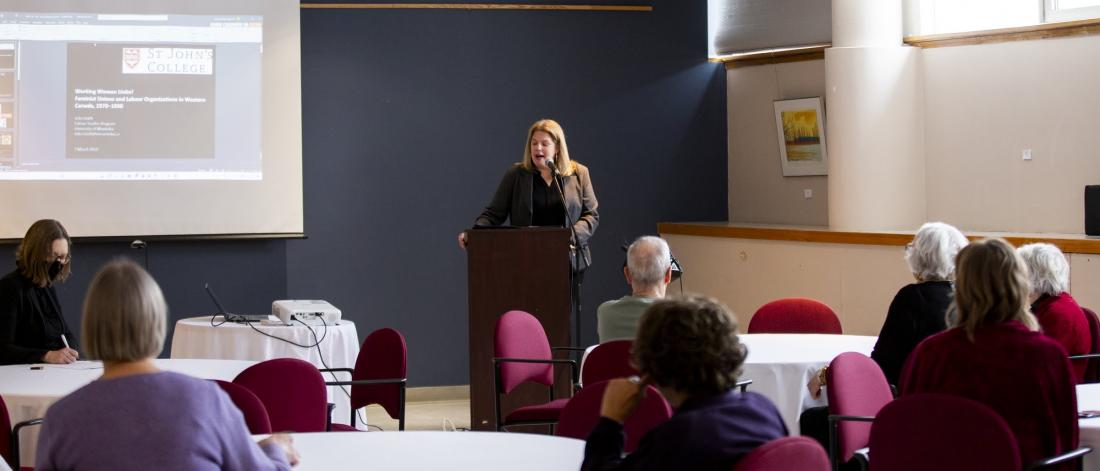 Dr. Allison Abra speaking to a crowd 